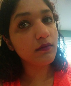 a selfie of Heina with colorful lipstick and other fancy makeup applied atop the natural look