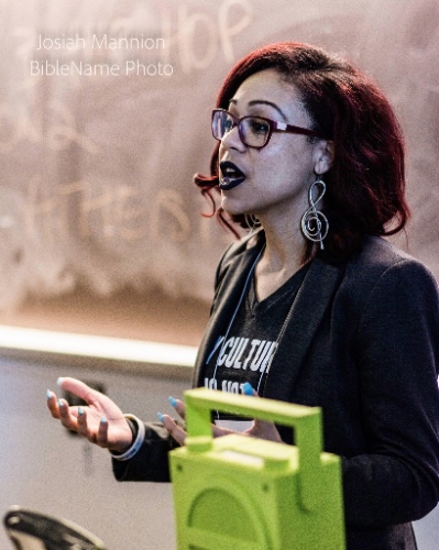 Photo of Xandelyn Wright behind her boom box during her presentation.