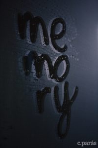 Photo of fogged mirror with "memory" written with a finger.
