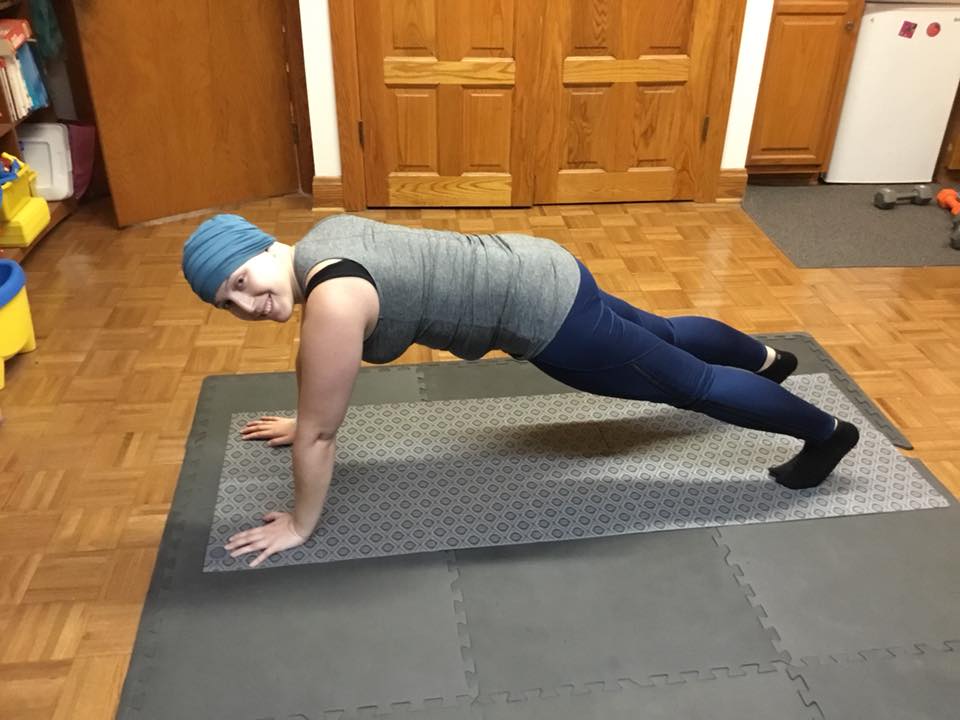 The author doing a high plank as part of their yoga practice.
