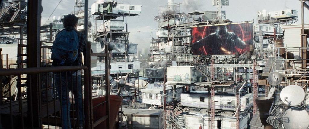 Wade Watts looks out over his trailer park city in the Ready Player One film.