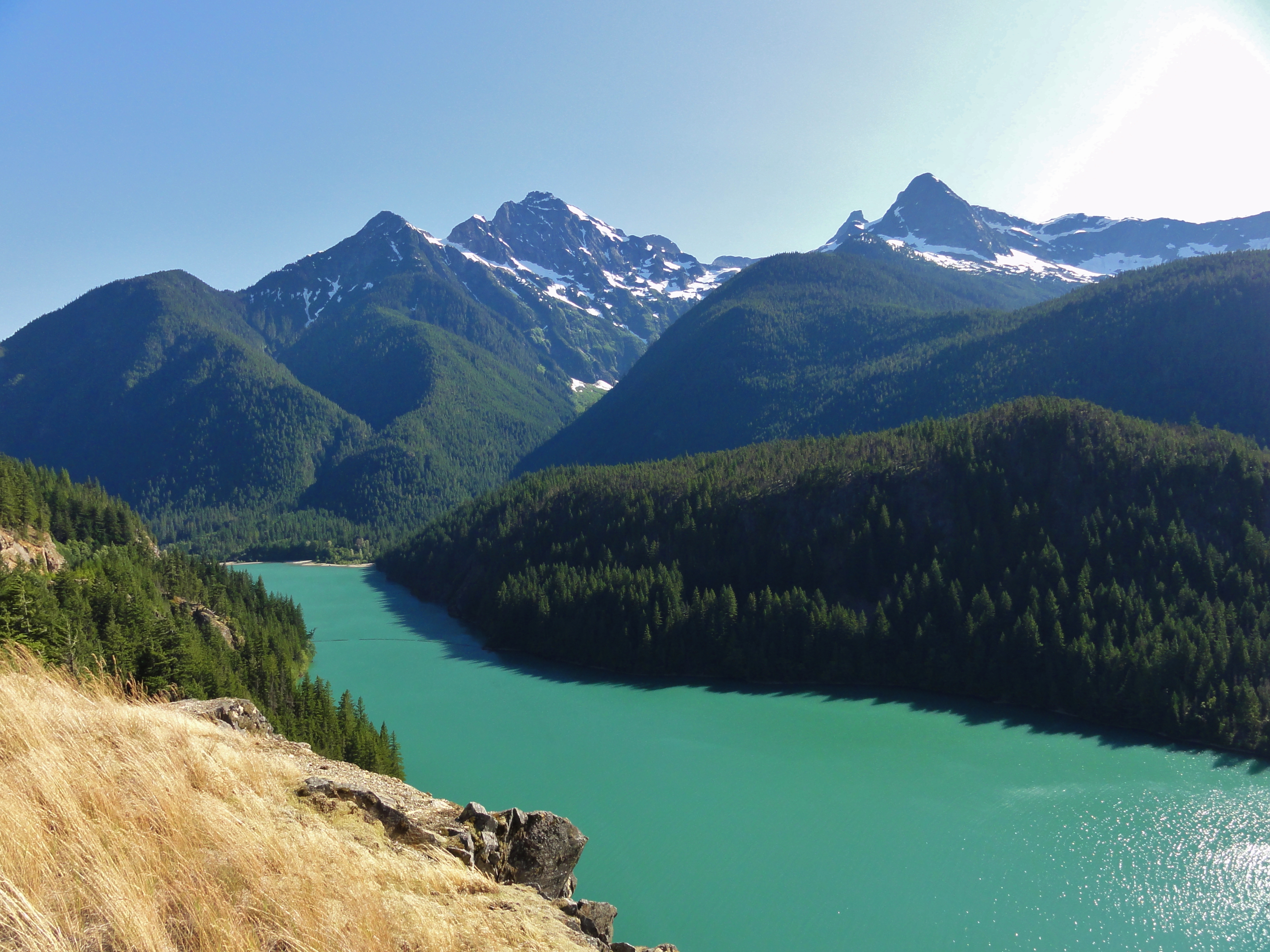 Colonial Peak and Pyramid Peak from Diablo Lake Overlook. The extraordinary blue of Diablo Lake is caused by glacial sediments carried down by creeks.