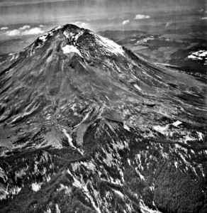 Image shows Mount St. Helens from the air. The black and white picture makes the volcano look quite stark and dangerous.