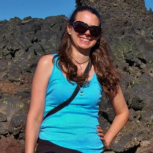 Image shows me standing in front of a bunch of basalt at Dee Wright Volcano Observatory.