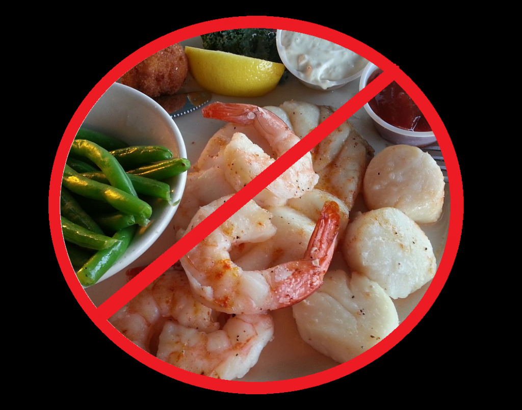 Image shows a shrimp and scallop dinner inside a red circle with a line through it.