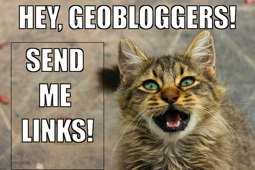 Image shows a tabby cat with green eyes meowing in the bottom right corner. Caption above and down the left says "Hey, geobloggers! Send me links!"