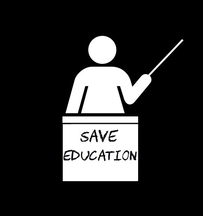 Image has a black background. A symbolic person holding a pointer is behind a podium that says Save Education.