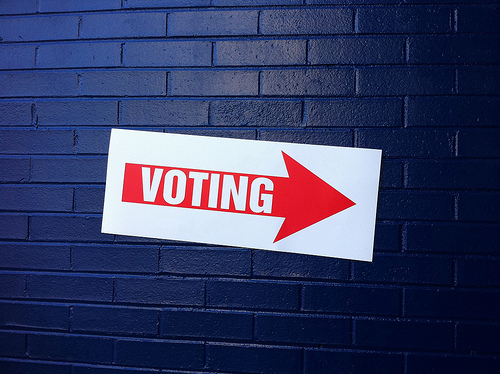 sign with arrow reading "voting"