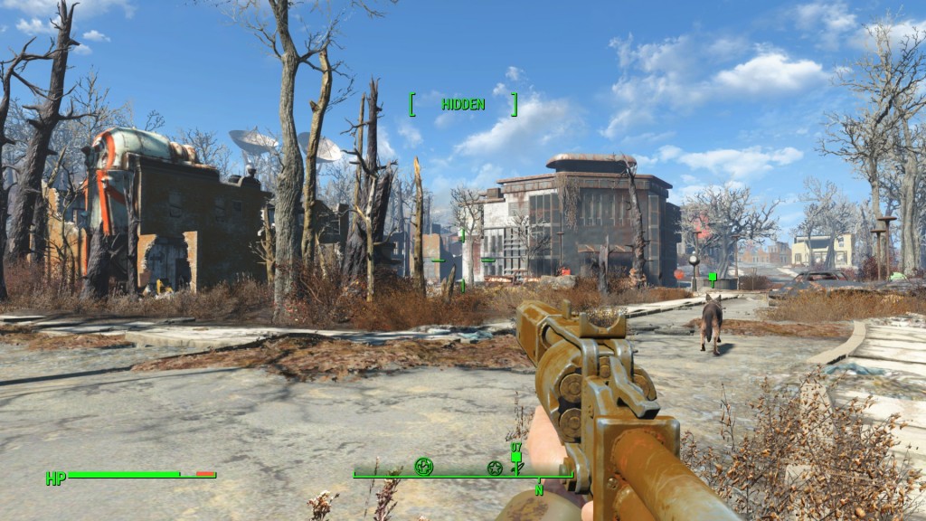 [Image: First-person view down the barrel of a pipe-revolver at a run-down military base. Dogmeat is leading the way down a broken road. In the foreground are dead, shriveled trees. In the background are three large satellite dishes.]