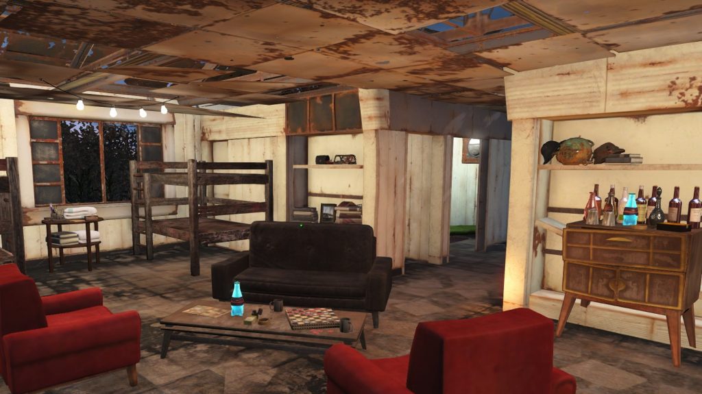 Inside Ms. Rosa's home has been completely cleared out to make room for a makeshift barracks. In the center of a room is a coffee table topped with clutter and a checkers game, surrounded by mismatched seating. In the back corners of the room makeshift bunkbeds are visible, as well as a small wetbar with scavenged drinks.